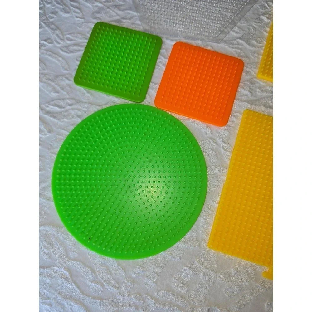 Lot D Perler bead pegboards in various shapes and bright colors